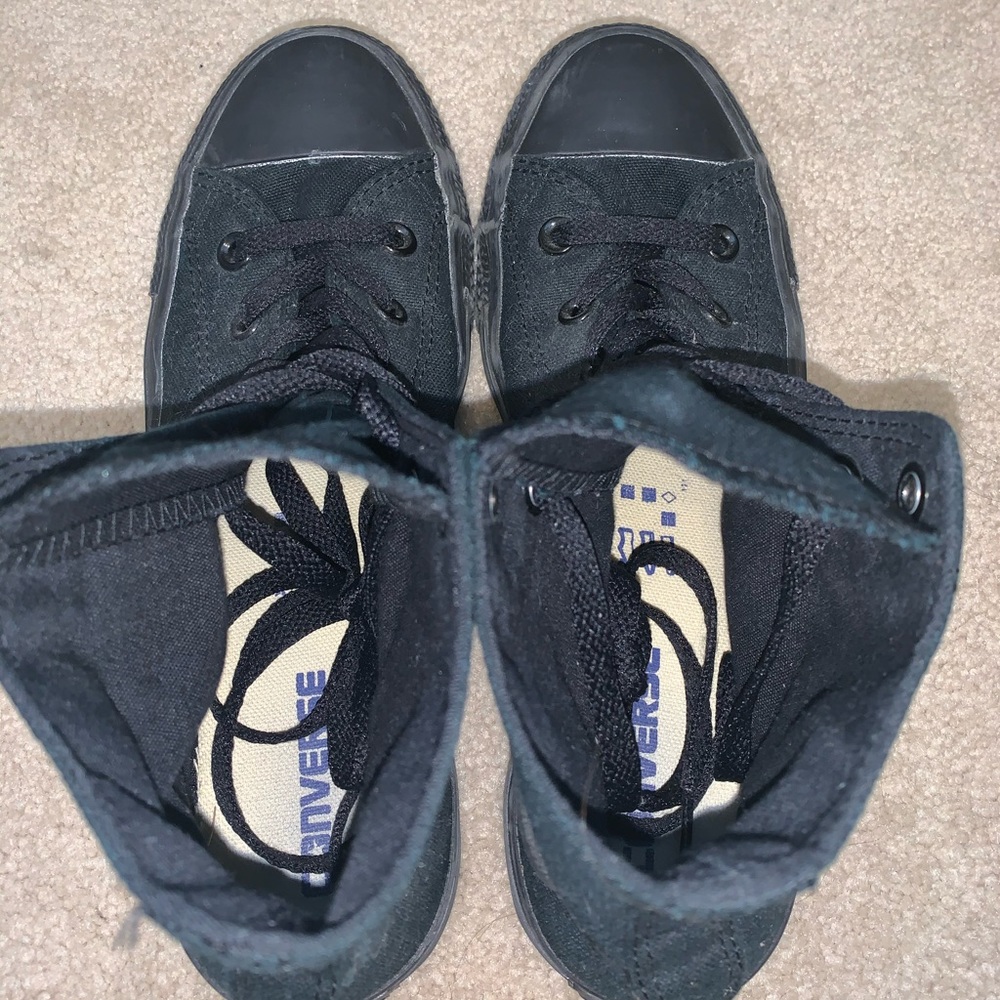 All black high top Converse